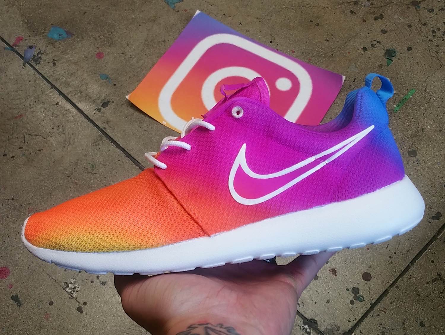 The "Instagram Logo" hand-painted Nike Roshe shoes. ($225 per pair; allow up to 4 weeks for delivery)