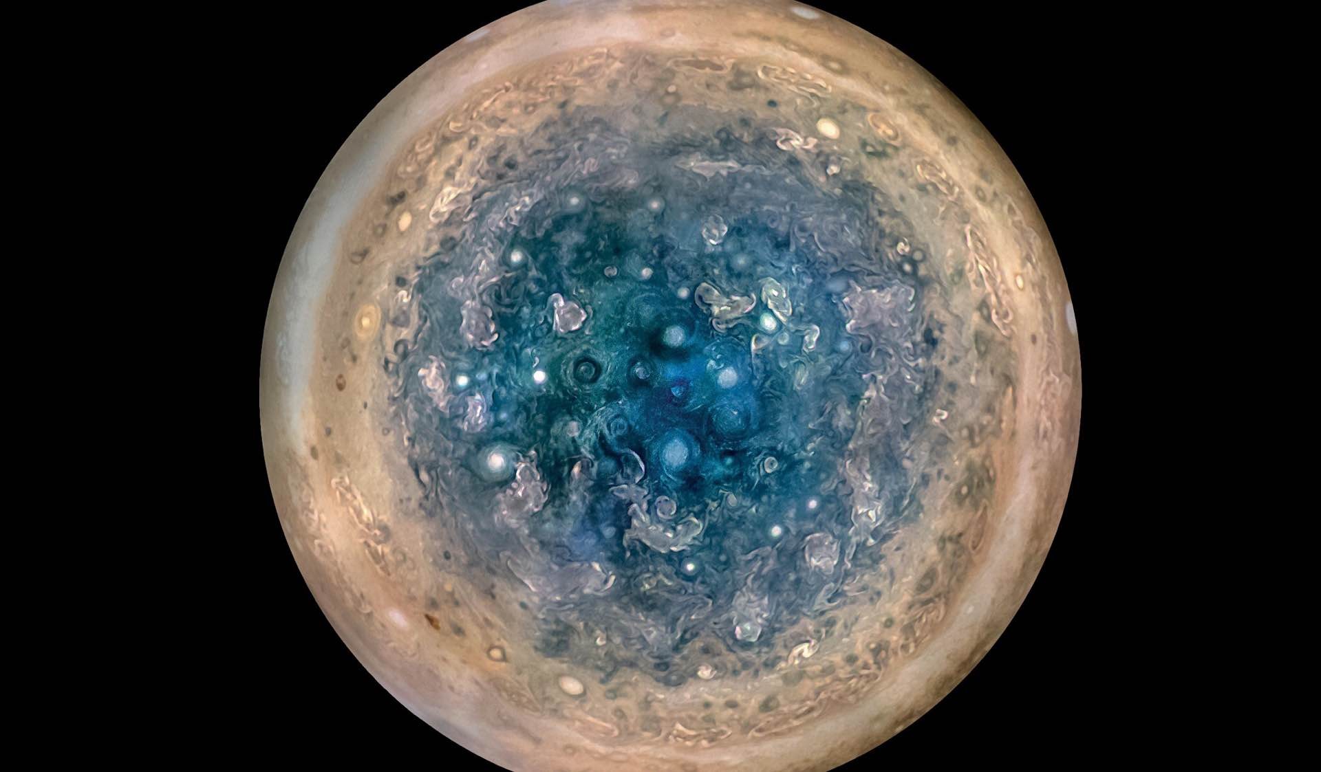 Jupiter's south pole, seen from a distance of just over 50,000 km.Photo credit: NASA/JPL-Caltech/SwRI/MSSS/Betsy Asher Hall/Gervasio Robles (but rotated and landscape'd by yours truly)